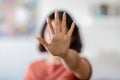 Unrecognizable Young Woman Covering Her Face With Open Palm, Showing Stop Gesture Royalty Free Stock Photo