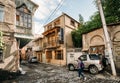 Unrecognizable young woman girl walking on a narrow street in th