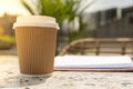 Unrecognizable Young woman study in beach resort. Drinking coffee from paper cup. Student making homework Female hands Royalty Free Stock Photo