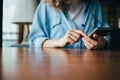 Unrecognizable young woman using mobile phone Royalty Free Stock Photo