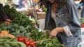 An Unrecognizable Young Womans Quest for the Perfect Vegetables, Herbs, and Greens Amongst Local Organic Stalls Royalty Free Stock Photo