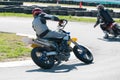 Unrecognized athlete riding a sports motorbike on a motocross racing