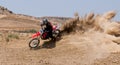 Unrecognized athlete riding a sports motorbike on a motocross racing event. Extreme sports high speed.