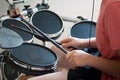 Unrecognized boy practicing electronic drums closeup Royalty Free Stock Photo