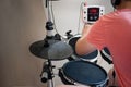 Unrecognized boy practicing electronic drums closeup Royalty Free Stock Photo