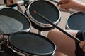 Unrecognized boy practicing electronic drums closeup Royalty Free Stock Photo