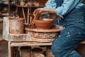 Unrecognized ceramicist modeling clay bowl in pottery workshop Royalty Free Stock Photo