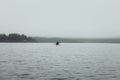 Unrecognized man in kayak. Summer trip on Ladoga lake in Karelia.