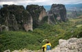 Unrecognized person enjoying the scenery at meteora rocky formation.