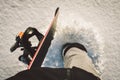 Unrecognized snowboarder walk on powder day on fresh snow with snowboard to freeride hilltop Royalty Free Stock Photo