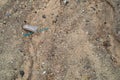 Unrecycled plastic cup in the sand. Royalty Free Stock Photo