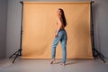 Unretouched photo of woman stand back rear posing for nude photo session on valentine day isolated studio background Royalty Free Stock Photo