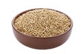 Unroasted buckwheat in a bowl. Useful dietary product. Isolated on a white background