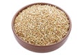 Unroasted buckwheat in a bowl. Useful dietary product. Isolated on a white background