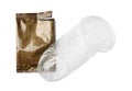 Unrolled female condom and torn package isolated on white, top view. Safe sex Royalty Free Stock Photo