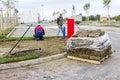 Unrolling grass, applying turf rolls for a new lawn Royalty Free Stock Photo