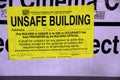 A unsafe building sign thats put on a building