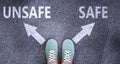 Unsafe and safe as different choices in life - pictured as words Unsafe, safe on a road to symbolize making decision and picking
