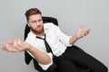 Unsatisfied tired businessman sitting in a chair