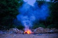 Unscientific burning of garbage in a public place in a late evening