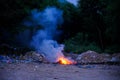 Unscientific burning of garbage in a public place in a late evening Royalty Free Stock Photo