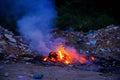 Unscientific burning of garbage in a public place in a late evening Royalty Free Stock Photo