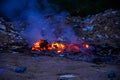 Unscientific burning of garbage in a public place in a late evening Royalty Free Stock Photo