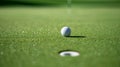 Unscored goal. One step away from victory. Golf ball on sun-lit green field near hole dew on grass. Royalty Free Stock Photo