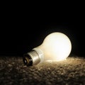 Unscrewed Glowing Light bulb Royalty Free Stock Photo