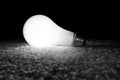 Unscrewed Glowing Light Bulb Royalty Free Stock Photo