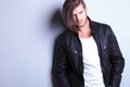 Unshaved young fashion model in leather jacket