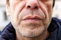 Unshaven face of a middle-aged Caucasian man close-up Royalty Free Stock Photo