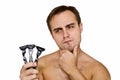 Unshaven guy with three razors Royalty Free Stock Photo