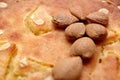 Unshelled almond nuts on a freshly backed frangipane tart or cake Royalty Free Stock Photo