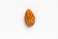 Unshelled almonds lie in the center on a white background Royalty Free Stock Photo