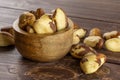 Unshelled brazil nut on brown wood