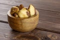 Unshelled brazil nut on brown wood