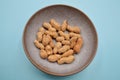 Unshelled dry roasted peanuts in a bowl Royalty Free Stock Photo
