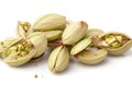 Unshelled pistachios isolated on white background