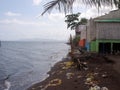 Unsightly abandoned resort bamboo and wooden cottages left untended by the owners due to bankruptcy Royalty Free Stock Photo