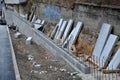 Unsightly road notch of the bridgehead. retaining wall with concrete grouting and drainage. fencing with hollow bricks filled with Royalty Free Stock Photo