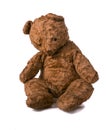 Unsightly sad vintage teddy bear. sitting on a white background Royalty Free Stock Photo