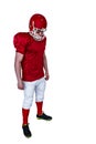 Unsmiling american football player looking down Royalty Free Stock Photo
