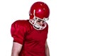 Unsmiling american football player looking down Royalty Free Stock Photo