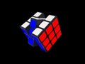 3x3 unsolved Rubik's Cube on the black background.