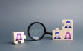 Unsorted team puzzle and magnifying glass. Search, recruitment staff, hiring leader. Lack of specialists in the labor market. Royalty Free Stock Photo