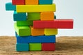 unstable colorful wooden block tower as Risk or stability concept