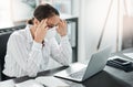 Unstable times lead to an increase in stress. a masked young businesswoman looking stressed while working at her desk in Royalty Free Stock Photo