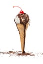 unstable waffle cone with white scoop, chocolate glaze and decorated chips and maraschino cherry of ice cream isolated on white Royalty Free Stock Photo