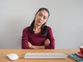 Unstatisfied and serious woman working on her desk.